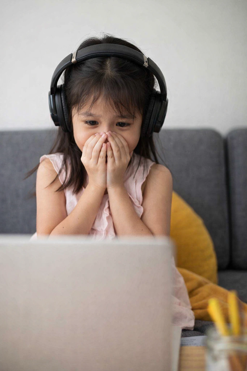 Shy child learning English comfortably