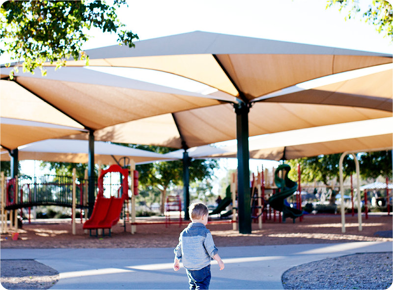 Commercial shade sail structure over a playground