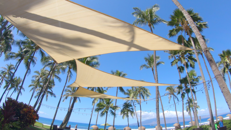 Commercial shade sails under intense sunlight